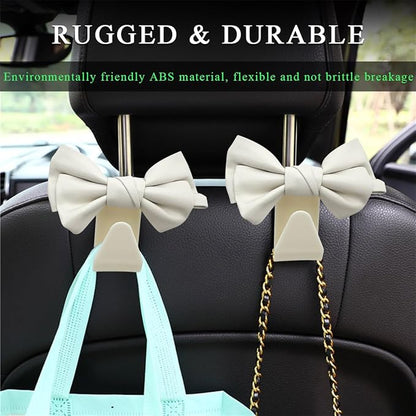 2 PCS Car Seat Headrest Hooks, Cute Bow Shaped Vehicle Backseat Storage Hooks, Leather Bow Shaped Sturdy Car Seat Back Hooks for Purses/Coats/Umbrellas, Car Accessories (White)