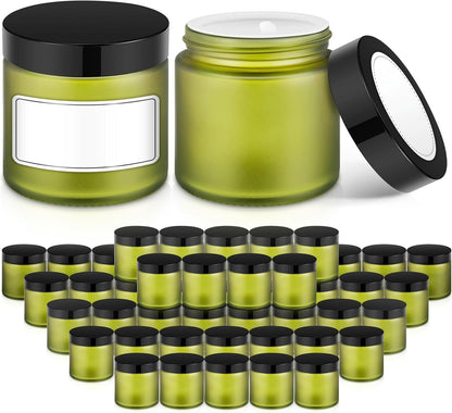 2 oz Small Glass Jars with Lids, Bumobum 48 pack Round Green Glass Candle Jars with Black Lids, White Labels & Inner Liners, Empty Cosmetic Containers for Cream, Lotion, Slime, Ointment